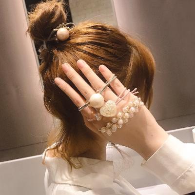 China Fashionable Popular Fancy Pearl Rubber Headband Fashionable Elastic Hair Bands For Women for sale