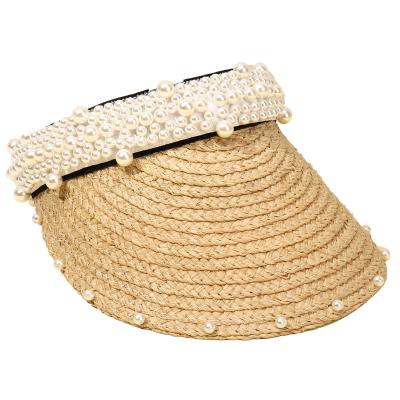 China Luxury Character Raffia Straw Visor Hat Pearl Headband Sun Visor Covers Natural Grass Beach Empty Sun Top Hat For Women for sale