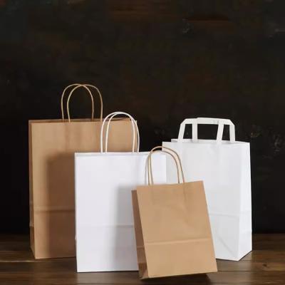 China Recycled Materials Hot Selling New Fashion Wholesale Eco Tote Luxury With Die Cut Handle Custom Gloss Matt Laminated Shopping Paper Bag for sale