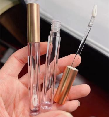 China High Quality Clear Slim Pink Gloss Gold Round Packaging Bottle Lipstick Container Cosmetic Tubes With Magic Wands Brush 1.5ml for sale