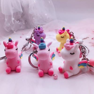 China New style key chain gift simulation unicorn bell shape bag unique creative plastic key chain car key chain pendant accessories for gift for sale