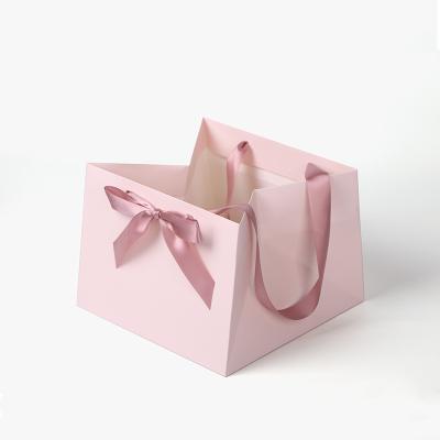 China Recyclable custom logo jewelry rose Ramadan potli gift bags luxury paper packaging with bow ribbon for sale