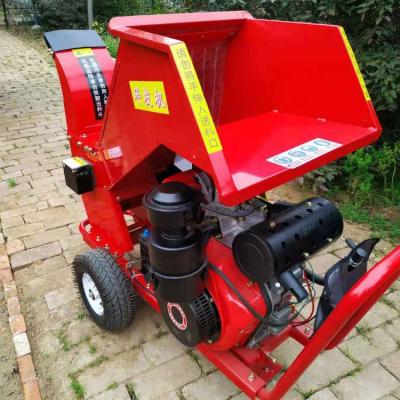 China Cutting forestry wood log scrap tractor wood chipper 3 point hitch CE approved small wood tractor bx42 bx52 bx62 bx72 bx92 PTO PTO driven portable chipper for sale