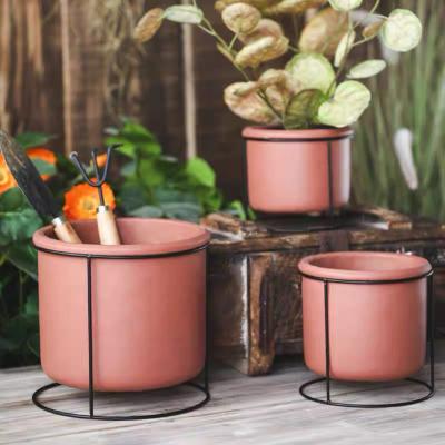 China Nordic Rustic Minimalist Desktop Decorative Round Bonsai Clay Cement Potted Plant Flower Home Succulent Pots With Iron Stand Holder for sale