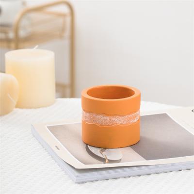 China High quality empty orange home decoration candle jar round colorful concrete decorative unique clay candle jars wholesale for sale