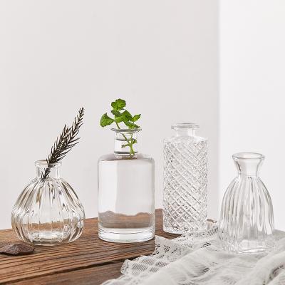 China Modern Wholesale Hot Sale Modern Simple Small And Elegant Oval Bud Vase Flowers Glass Vase For Wedding Bathroom for sale