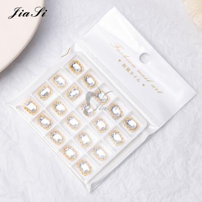 China Luxury Brand Logo Alloy Metal Nail Art Charms 3D Rhinestone Jewelry Zircon Decoration Designer for sale