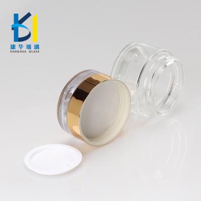 China Luxury Custom Recyclable Material 20g 30g 50g Skin Care Container Round Glass Cosmetic Packaging Jars With Gold Lid for sale