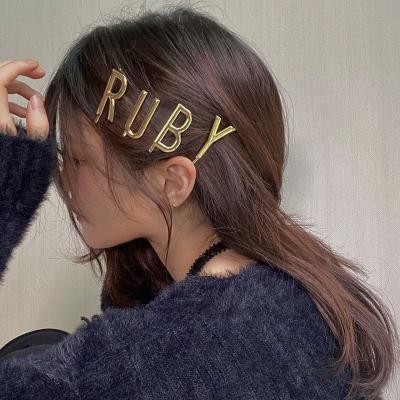 China Hotsale Women Girl Alphabet Letter R U B Y Soft Nine Word Gold Plated Metal Side Clip 20ACH071 for sale