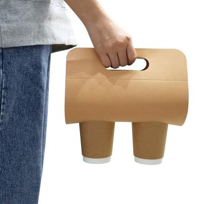 China Disposable Kraft Cardboard Take Away Disposable Cold-Hot Drinks 1/2 Cup Holder Disposable Cups Carrier Holder For Coffee With Handle for sale