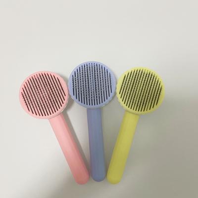 China Pet Hair Removal Comb Pet Brush Comb Stocked Hair Brushes for sale