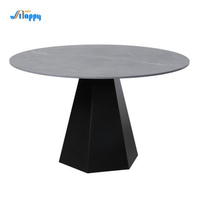 China Moderne ronde eettafel met een ijzeren onderstel. Te koop