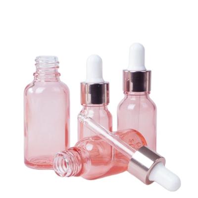 China 10ml 15ml 20ml 30ml Rose Essential Oil Stock Serum Cosmetic Bottles Low MOQ Empty Glass Dropper Bottle With Rose Gold Cap for sale