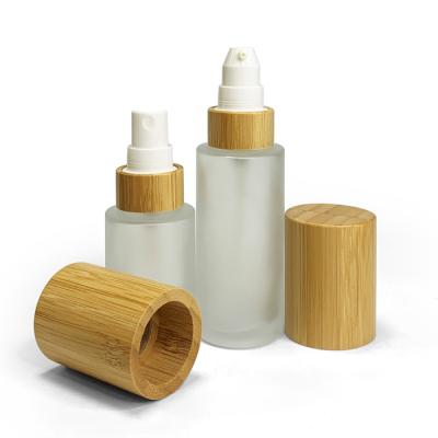 China 30ml 50ml 60ml 100ml 120ml Empty Clear Transparent Frosted Lotion Glass Bottle Cosmetic Packaging Flat Shoulder With Bamboo Pump Cap for sale