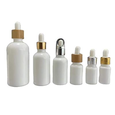 China 5ml 10ml 15ml 30ml 50ml 100ml Cosmetic Empty Liquid Serum Essential Oil Bottles Screen Printing White Porcelain Dropper Glass Bottle for sale