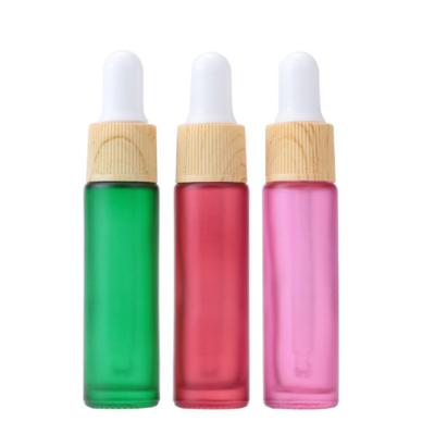 China Factory direct sale cosmetic cosmetic packaging small custom color dropper essential oil glass bottle with bamboo cap for sale