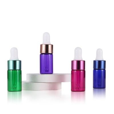 China Cosmetic Ready To Ship Essential Oil Mini Glass Bottles 3ml Colors Vials Serum Bottling Bottles Mixed Empty Dropper Bottle for sale