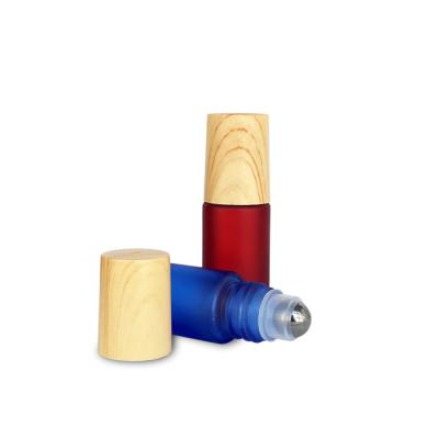 China Hot Sale Cosmetic Wholesale Customizable Empty Roll On Package 5ml Portable Red Blue Colorful Glass Roll On Minisize Essential Oil Bottle for sale