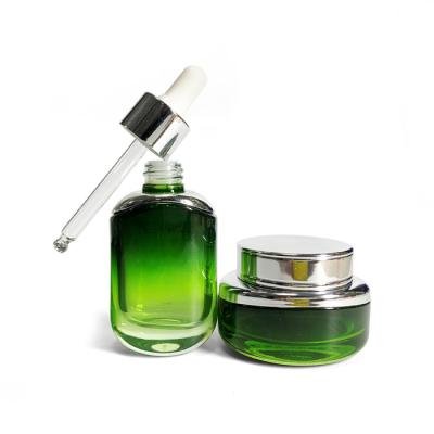 China Empty Set 30ml 50ml Green Hair Serum Oil And Skin Care Cream Empty Gradient Dropper Bottle Cosmetic Packaging Glass Jar for sale