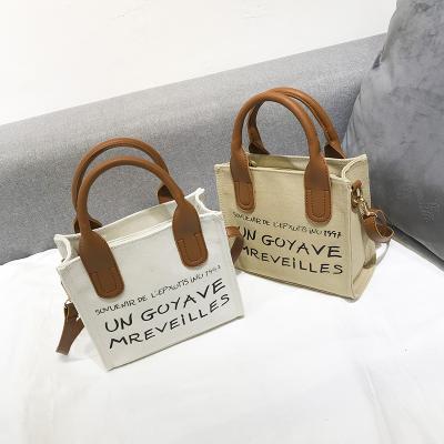 China 2020 Female Korean Canvas Handbag Letter Small Square Bag Messenger Bag Fashion Sling Canvas Print Canvas Handbag Ladies Handbags For Women for sale