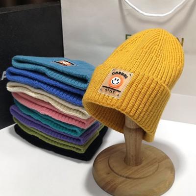 China GEERDENG COMMON 2021 Customize Smile Face Winter Thick Woolen New York Knitted Beanie Hats For Girls New York Hats for sale