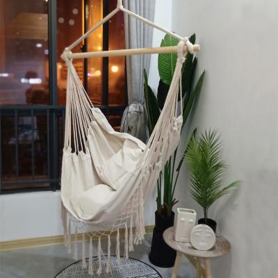 China INS Amazon hot sale hammock chair with wooden bar with tassel and pillows hanging chair swing chair for outdoor or indoor hangematte for sale