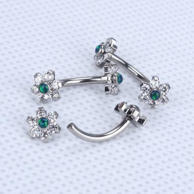 China ASTM F136 Titanium Internal Threaded Piercing Curved Barbell With 6 Petal Jeweled Flower Ends for sale