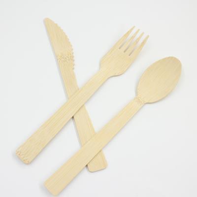 China Multifunctional and simple and real disposable bamboo spoon fork and knife cutlery set eco-friendly flatware bamboo dinnerware set for sale