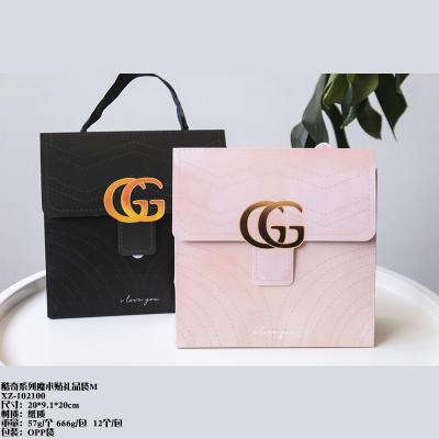 China Handmade Exquisite Portable Clamshell Packaging Stationery Gift Cardboard White Paper Bag for sale