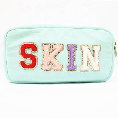 China Fashion hot sale nylon waterproof cosmetic bag with shiny letters customized for sale