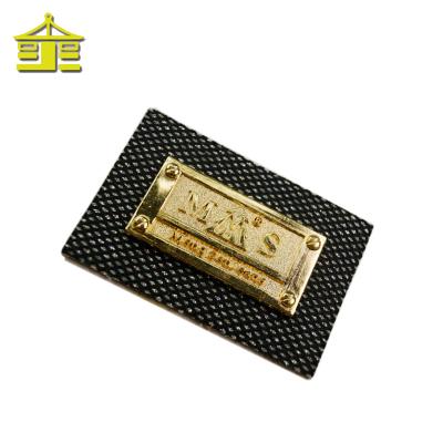 China Durable Faux Metal Embossed Clothing Custom Private Lattice Patch Jeans Designs PU Leather Labels For Handbags for sale