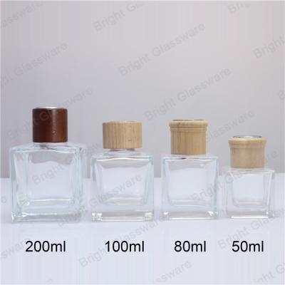 China Custom 50ml 100ml 150ml 200ml Square Diffuser Bottle with Wooden Lid for sale