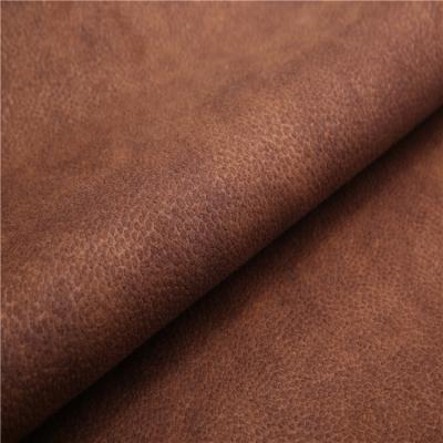 China Shrink-Resistant Polyester Embossed Pattern Tanned Suede Wholesale Car Seats Fabrics Faux Leather Sofa Fabric for sale