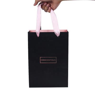 China Recycled Materials Custom Exquisite Cosmetics Paper Gift Box And Shopping Paper Bags With Handles for sale