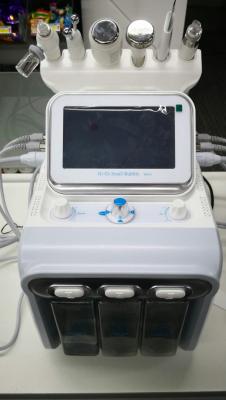 China Professional 430*380*380mm portable white hydrafacial machine with 6 handles for face cleaning and lifting for sale