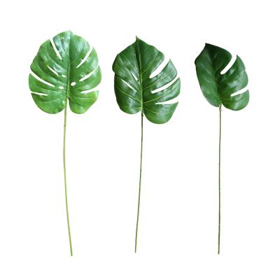 China Plastic Silk Realistic Fake Plants Fake Monstera Leaves Real Touch Plant Artificial Green Leaves For Home Wreath Garland Wall Panel Decor for sale