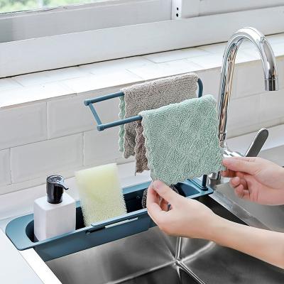 China New Kitchen Sink Drain Basket Double Layer Cavity Expandable Plastic Sponge Soap Rack Viable Telescopic Storage Rack for sale