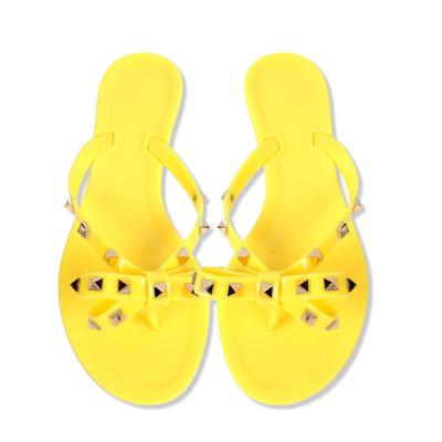 China Brand Lightweight High Top Summer Candy Jelly Pvc Rockstud Bow Flip Thong Sandals For Women for sale