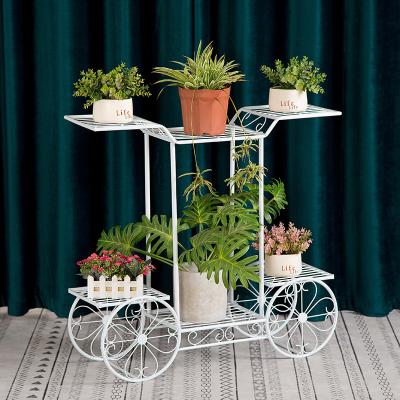 China Europe Metal Flower Pot Rack Display Plant Stand Floor Wedding Decoration High Quality Indoor Flower Stand in 4 Wheels for sale