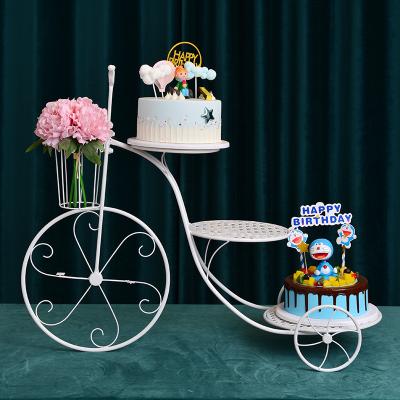 China Wholesale European light luxury party wedding cake stand metal wheel decoration factory direct supply bicycle cake stand for sale