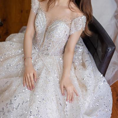 China Anti-Static Short Sleeve Princess Wedding Dress With Crystal Applique Embroidered Lace Women Wedding Dress for sale