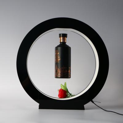 China Rotating Floating Magnetic Floating Display Rack Magnetic Levitating Store Show Rack Liquor Wine Display Beer Bottle With Led Light for sale