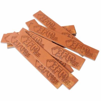 China Viable Customized PU Garment Label Clothing Brand Jeans Label Faux Leather Patch Logo Leather Tags For Clothes Custom Made for sale