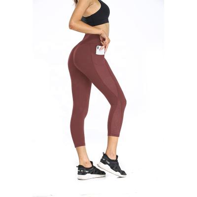 China Custom Fashion Breathable New Mesh Women Fitness Legging With Pockets High Waist Workout Wear Gym Pants Yoga Leggings for sale