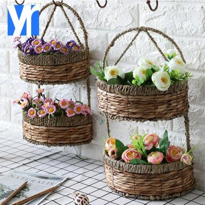 China Eco-friendly Cheap Rattan Woven Plant Flower Basket Planter Woven Wall Hanging Basket Wall Hanging Storage for sale