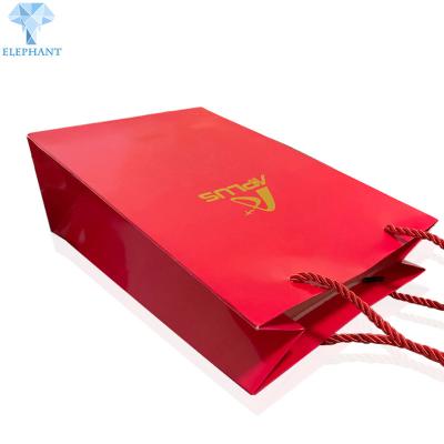 China OEM Logo Kraft Paper Shopping Bags con las manijas Matt Varnish a granel en venta