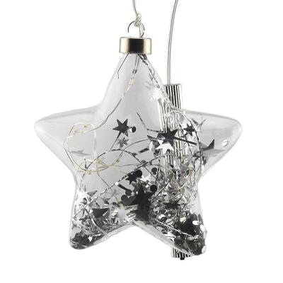 China Christmas Festival Home Decoration Transparent Clear Star Shaped Led Light Up Christmas Bauble Glass Ball Ornaments Filled With Silver Stars For Holiday Wedding for sale