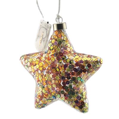 China Christmas Festival Home Decoration Led Hanging Star Shaped Glass Glitter Filled Christmas Bauble Ball With Lights Up Christmas Tree Hot Sale Home Holiday Ornament for sale