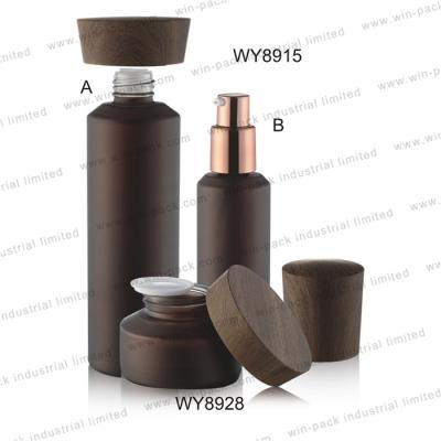 China 100ml personal care pump lotion luxury unique fancy cosmetic glass bottle with black color wood lid and cap for sale