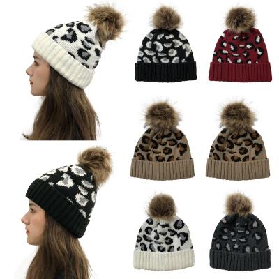 China Amazon COMMON Women's Fashion Leopard Knitted Hat Cute Girls Wool Beanie Hat With Pom Pom Warm Ball for sale